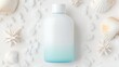 © Yulia - Minimalist sea-inspired skincare bottle with seashells on white sand background