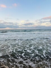 Wall Mural - Tender purple clouds reflection at the seashore, beautiful sunset seascape, empty sea beach, fantastic clouds reflection on the sea surface