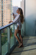 © Volodymyr - Morning coffee. Sensual woman enjoy coffee at terrace balcony on summer vacation time. Elegant woman drinking coffee at home. Beautiful young woman drinking coffee.