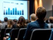© John - Business conference with professionals listening to a presentation on financial trends