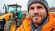 © Pinklife - A content construction worker wearing winter gear and standing near a tractor, exhibits warmth and resilience at a worksite, representing  endurance and adaptability in changing climates.