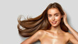 © ChimE - Stunning woman with flawless skin and lustrous hair against a soft grey backdrop, radiating natural beauty.