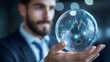 © Phichaphat - Businessman Holding Financial Data Sphere