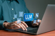 © Pakin - LLM, AI large language model concept, Big data, data transfer, generative ai, natural language generative and data mining. Businessman using laptop with LLM icons on virtual screen.