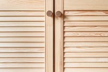 Wall Mural - Wooden louvered doors with wooden knob handles close-up. Louvered doors of outdoor kitchen are made from light pine wood with natural grain pattern