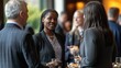 © Ari - A professional networking event with diverse attendees mingling