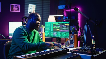 Poster - Famous piano teacher conducting internet master class via vlog tutorial, teaching people how to hit the right notes on electronic keyboard. Young artist performer hosts synthesizer lessons. Camera B.