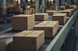 © khalid_spk - Close-up of multiple cardboard box packages moving along a conveyor belt in a warehouse