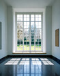 © JuanM - Bright daylight streaming through large windows in a modern room overlooking a garden