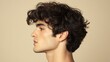 © Napasnan - Side profile of a man with big, textured hair, looking away on a minimalist neutral background