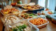 © Evon J - Delicious home cooked meal with various dishes on a wooden table for family gathering Sinkie Day