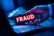 © Ram - Illuminated fraud sign held over calculator symbolizing financial fraud detection, accounting crime, cybersecurity risks, and financial security awareness
