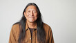 © Robert Kneschke - Portrait of a delighted man with long hair smiling confidently