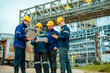 © Hip.hub - Group of workers teamwork Industry in oil refinery equipment Check and check the condition of the machinery system , Engineering concept.