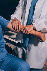 Doctor or Physiotherapist working examining treating injured arm of athlete male patient, stretching and exercise, Doing the Rehabilitation therapy pain in clinic.