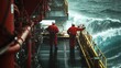 © Gentle Bunny - Two workers in red jackets stand on an offshore platform, gazing at turbulent waves, depicting the challenges of maritime environments.