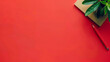 © Mirjana - A vibrant red workspace featuring a notebook, a green plant, and a red pen for creative marketing messages