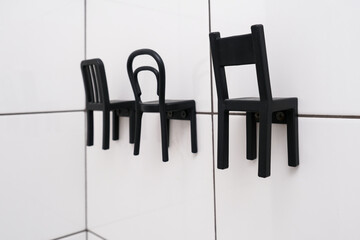 Funny modern hooks chair shape in the bathroom, space organization concept