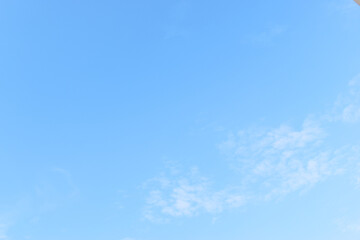Wall Mural - beautiful blue sky and white fluffy group of clouds with sunrise in the morning, natural background