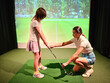 © Nadzeya - Athletic woman trainer teaches teenage girl child to play golf concept