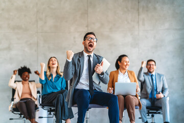 Wall Mural - Excited overjoyed diverse business people, team celebrate corporate victory together in office