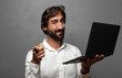 © kues1 - young adult man using a laptop