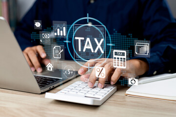 Tax and Vat concept. Government, state taxes concept. Businesman using calculator and laptop to complete Individual income tax return form online for tax payment. Data analysis, financial research.