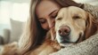 © JoxyAimages - A woman shares an affectionate cuddle with her relaxed dog indoors, capturing the warmth and security of a loving home environment, resonating with quiet contentment.