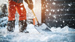 © Ruslan - A man with a shovel removes snow near a house on a snowy winter day