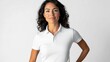 © Denisa - A middle-aged Hispanic woman wears a stylish polo shirt, featuring a crisp collar and buttons