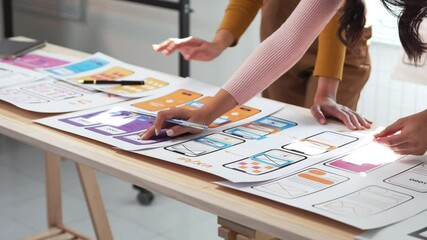 Wall Mural - collaboration among ux designers drives the development of an innovative app project, enhancing user