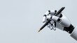 © Petchladda - A robot is holding a pen and writing on a white background