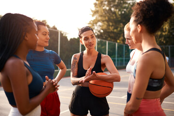 Wall Mural - Group, huddle and women with basketball, outdoor and energy for sport, friends and together with ball. Fitness, game plan and team in weekend, training and practice for competition and people