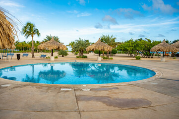 swimming pool with sun loungers