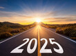 © Alfredo - New year 2025. Text 2025 written on the road in the middle of asphalt road at sunset.