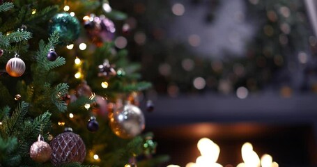 Wall Mural - christmas tree decorated with beautiful toys and gifts near the fireplace with fire. home christmas 