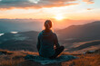 © Ram - Woman sitting on a mountain, meditating at sunrise, enjoying peaceful solitude, and connecting with nature, representing mindfulness, calm, and self-reflection