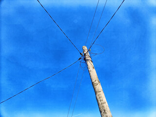 Wall Mural - Old pole with wires against the sky. Electric transmission line. Eco-friendly energy