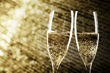 Wall Mural - toasting with champagne glasses on sparkling holiday background - Fireworks at New Year and copy space