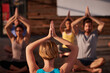 © peopleimages.com - Prayer hands, instructor or people in yoga class for chakra energy, mental therapy and inner peace. Group, wellness and zen yogi in studio with spiritual healing, breathe control or calm mindfulness