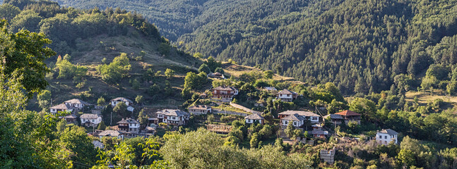 Wall Mural - Mountain village on the hills in traditional style popular hiking destination village. Rural scene.