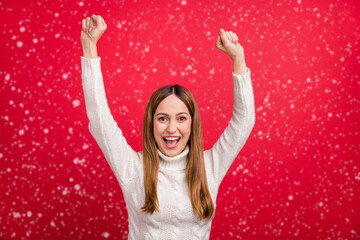 Portrait of attractive cheerful lucky woman rejoicing attainment having fun isolated over vivid red color background