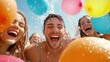 © starush - Friends enjoy a vibrant water balloon fight under a clear blue sky, laughing joyfully, AI