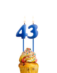 Candle in shape of the number 43 - Blue birthday on a white background.