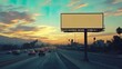 © leymart - Blank billboard on a busy highway with a sunset backdrop.