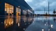 © aironamad - Modern Office Building Reflected in Rainwater on a Gloomy Evening