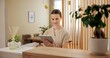 © peopleimages.com - Beauty, spa and woman at front desk with tablet checking website for online appointment booking. Consultant, receptionist or girl at reception with digital app for schedule plan at luxury hotel salon