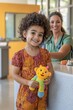 © naravadee - A parent checking in their child at a pediatrician s office, the child holding a favorite toy while the receptionist smiles warmly, vibrant colors, and a welcoming atmosphere