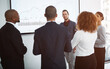 © peopleimages.com - Workshop, business people and screen in office for finance, annual report or company growth improvement. Group meeting, question or graph on display for planning, budget review or feedback discussion