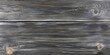 © Nijat - The texture of gray black wooden planks shows subtle indications of wear and aging, creating a close up view that highlights these characteristics.